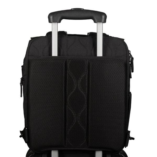 Willow forest black diaper bag attached to roller luggage with luggage pass-through