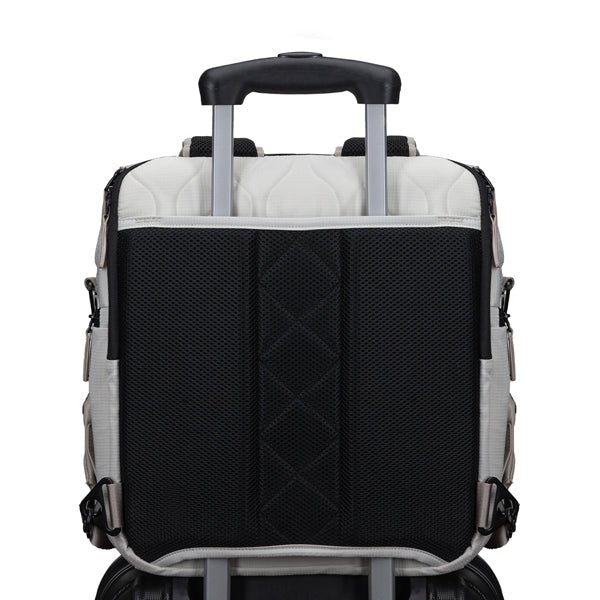 Willow mushroom diaper bag attached to roller luggage with luggage pass-through