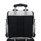 Willow mushroom diaper bag attached to roller luggage with luggage pass-through