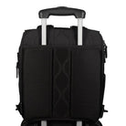 Willow forest black diaper bag attached to roller luggage with luggage pass-through
